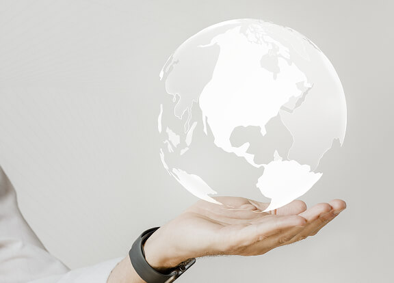 MoneyGram International with company logo, hand holding earth globe